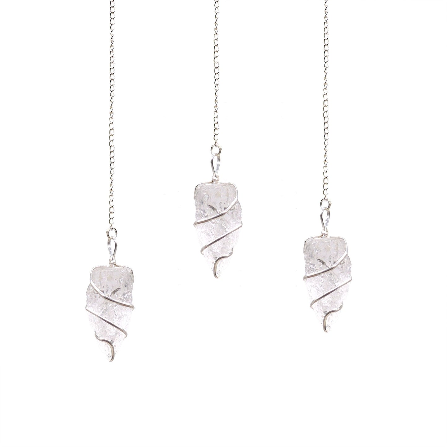 A natural, unpolished clear rock quartz gemstone pendulum suspended from a simple silver-coloured chain.