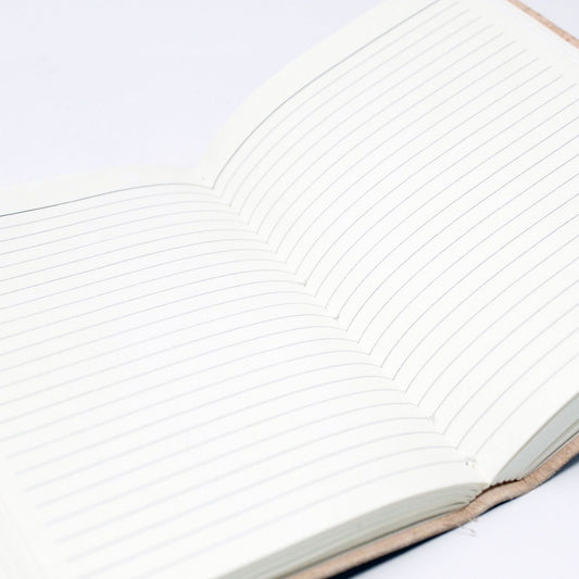 Vintage style leather notebook featuring embedded chakra stones, metal clasps, and a rustic wrap-around strap.