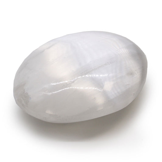 Smooth oval milky white selenite crystal palm stone with a natural lunar shimmer.