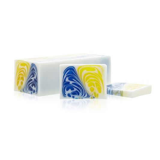 Handcrafted artisanal soap loaf with a textured green and white design, infused with jasmine and green tea botanicals.