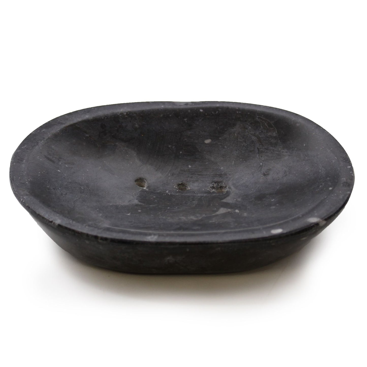 Handcrafted oval soap dish carved from polished black marble with unique natural white veining.