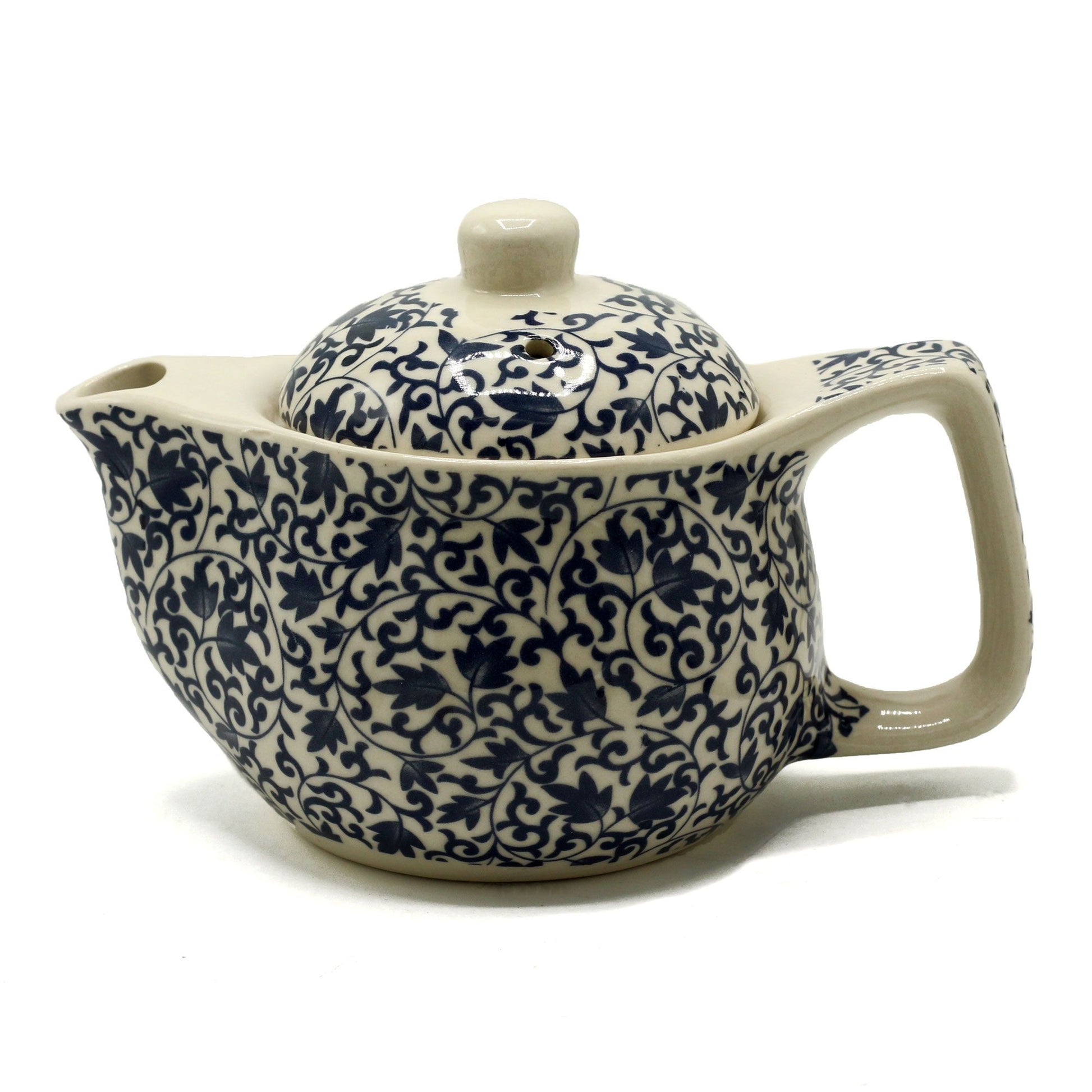 Small ceramic herbal teapot featuring an intricate blue pattern design with a matching lid.