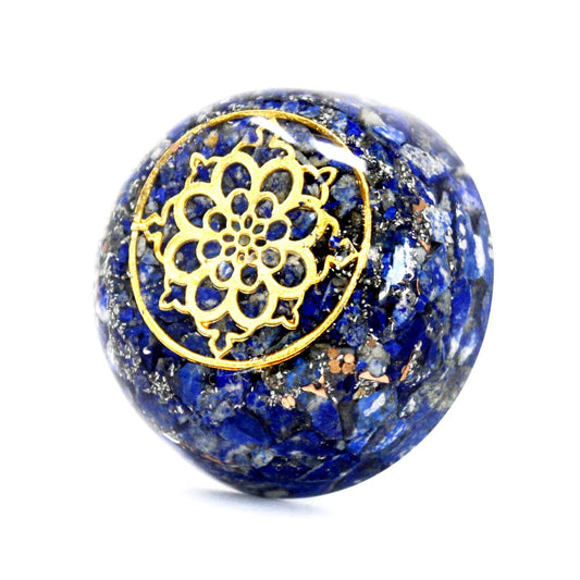 Dome-shaped orgonite desk ornament containing blue lapis lazuli gemstone chips, copper, and metal filings.