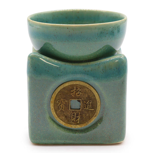 Large jade green ceramic oil burner featuring an intricate traditional lucky coin design and a deep bowl for oils.