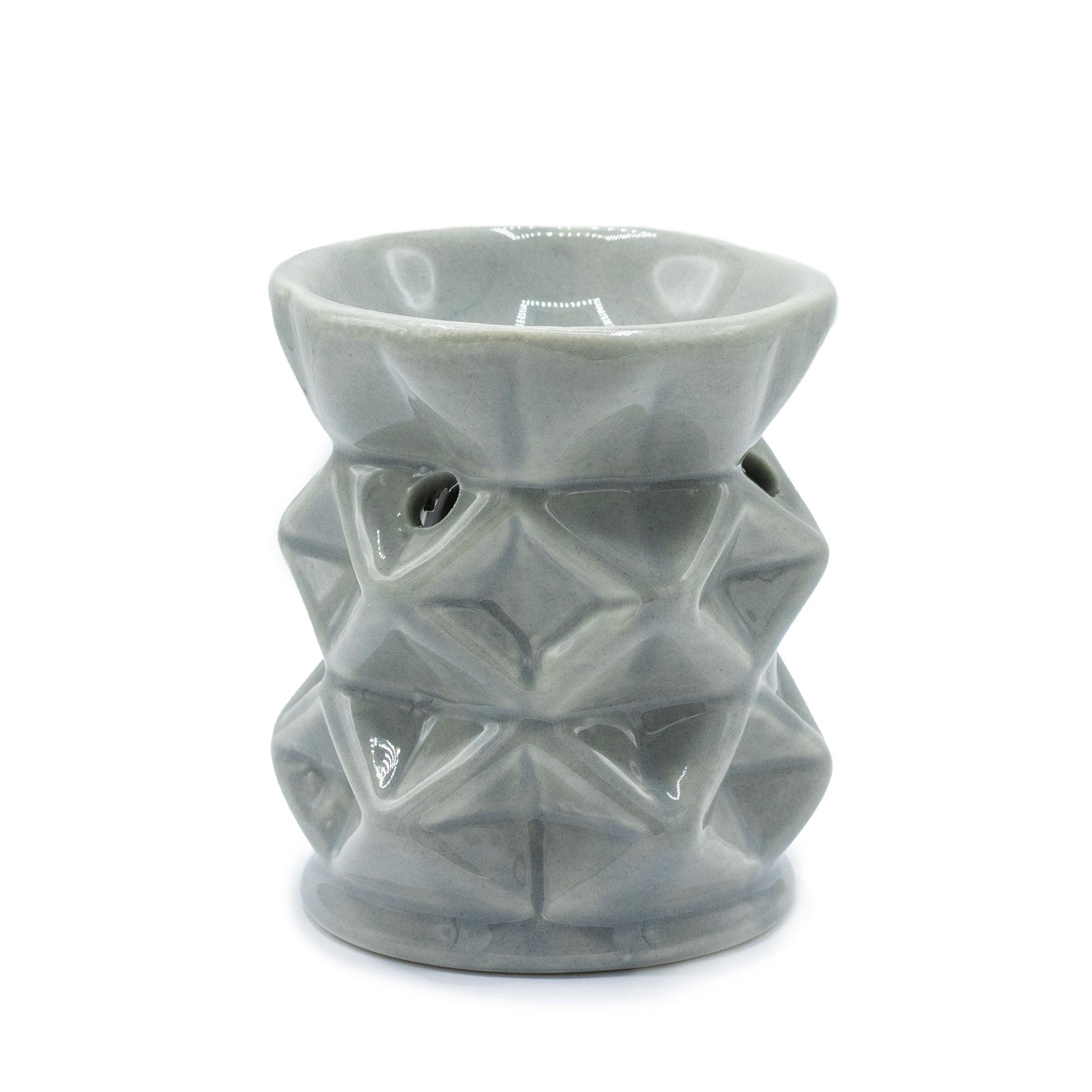 Modern grey ceramic oil burner featuring a minimalist geometric pattern with a cut-out design for a tealight candle.