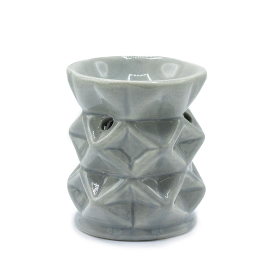 Modern grey ceramic oil burner featuring a minimalist geometric pattern with a cut-out design for a tealight candle.