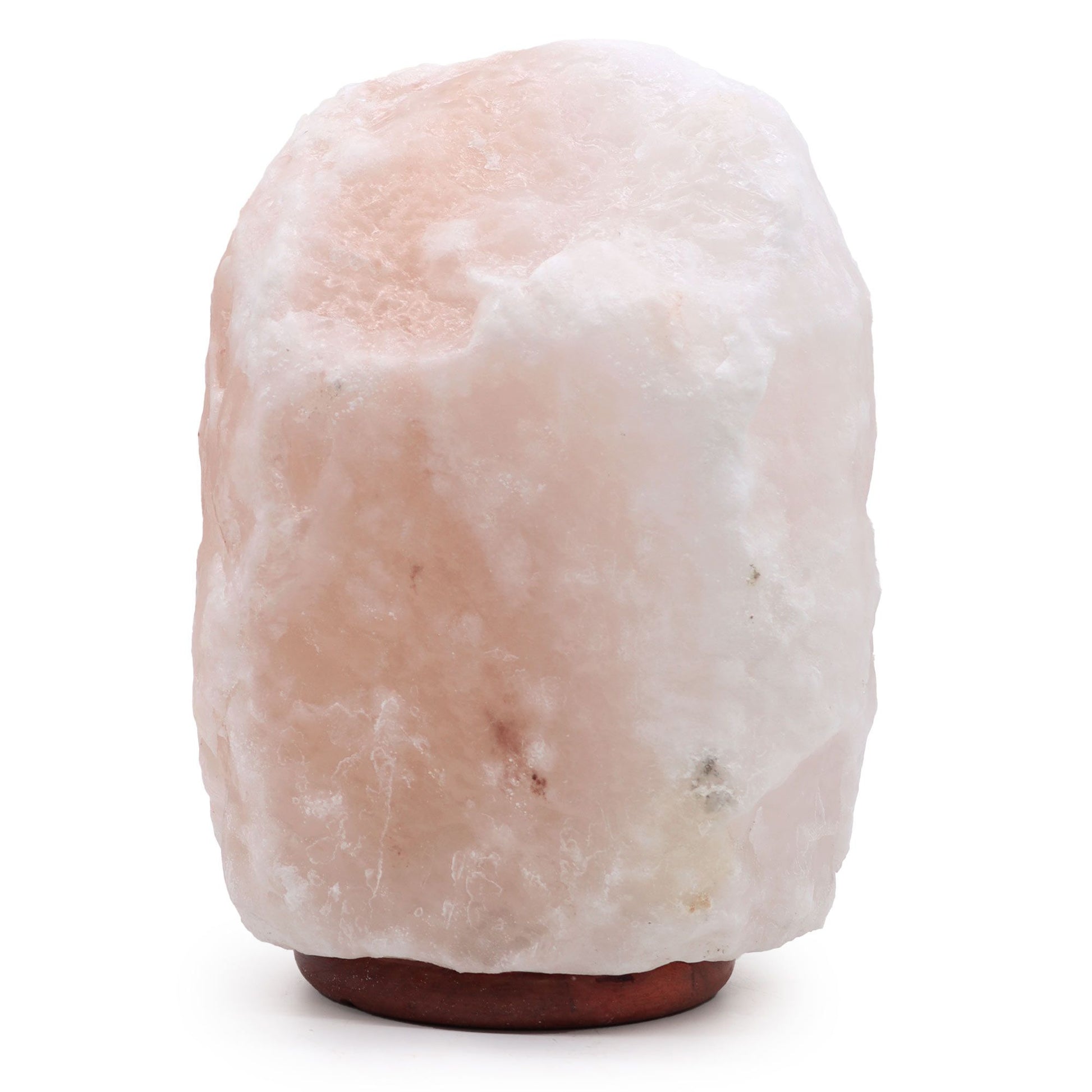 Extra large natural Himalayan salt lamp on a wooden base emitting a warm orange glow.