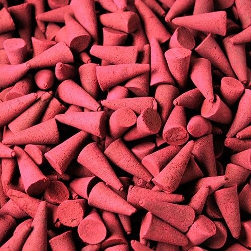 A large collection of dark red dragon's blood incense cones measuring twenty-five millimetres in height.
