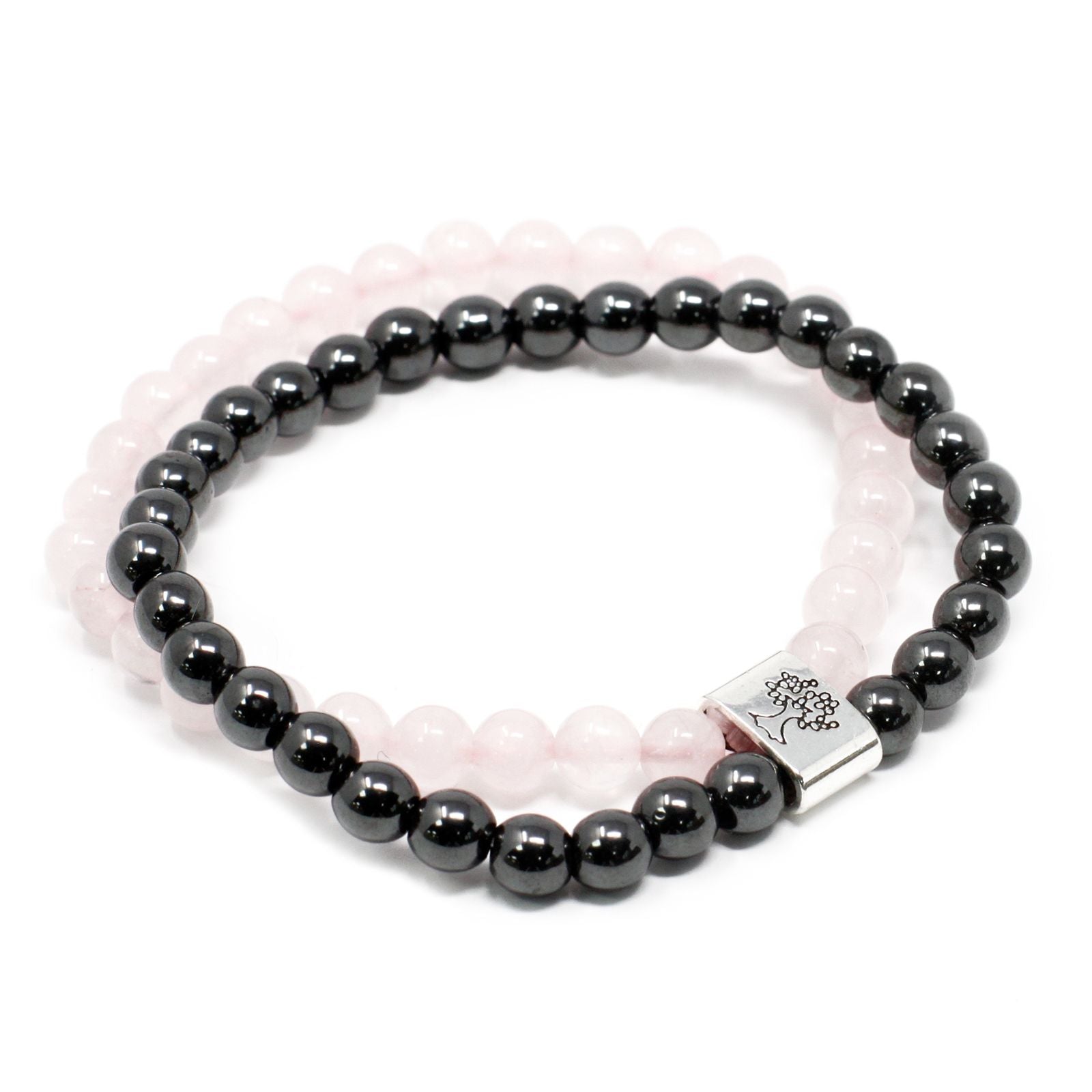 Handcrafted rose quartz gemstone bead bracelet with small magnetic spacers on a flexible elastic cord.