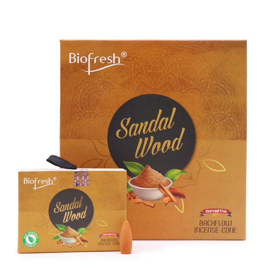 Sandalwood backflow incense cones showing a mesmerizing downward flow of fragrant white smoke in a serene setting.