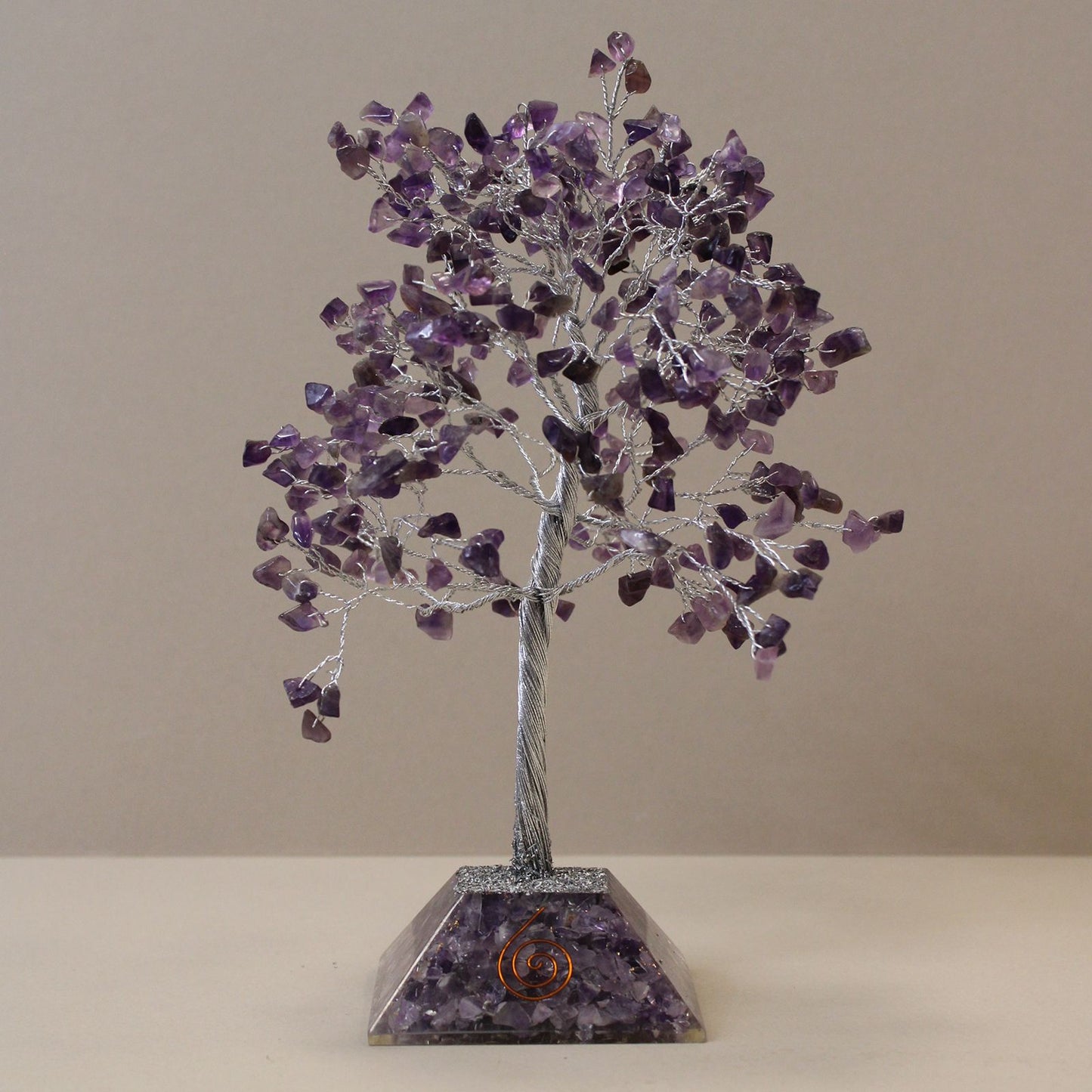 Handmade Amethyst gemstone tree with 320 crystal chips on a pyramid shaped orgonite base.