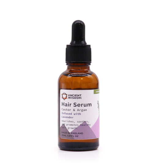 Small amber glass bottle of organic lavender hair serum with a dropper lid and purple label.