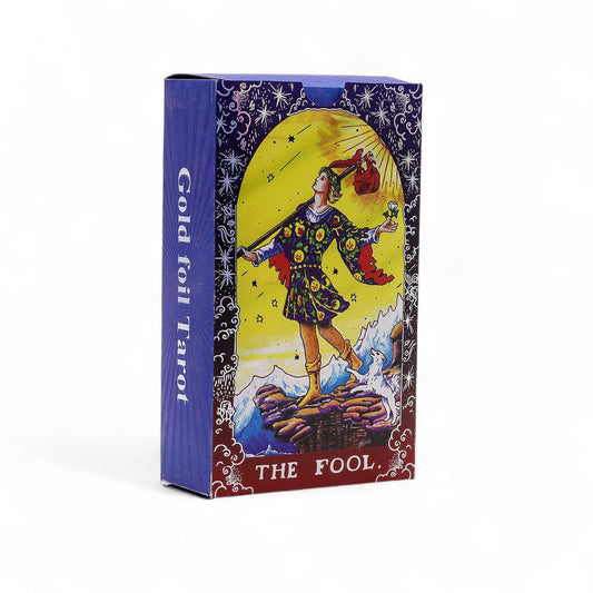 Intricate blue and gold foil tarot cards featuring sacred geometry mandala designs and a guidebook.