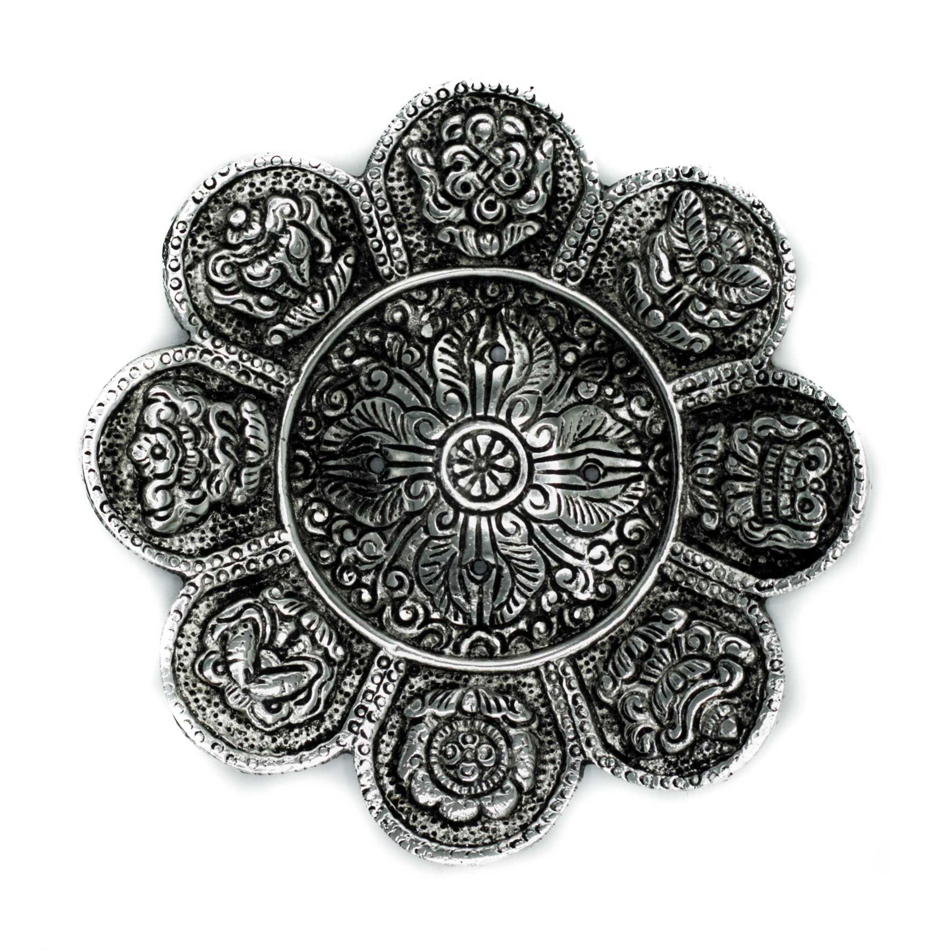 Handcrafted polished aluminium incense holder with engraved Tibetan symbols and a tall cylindrical design.
