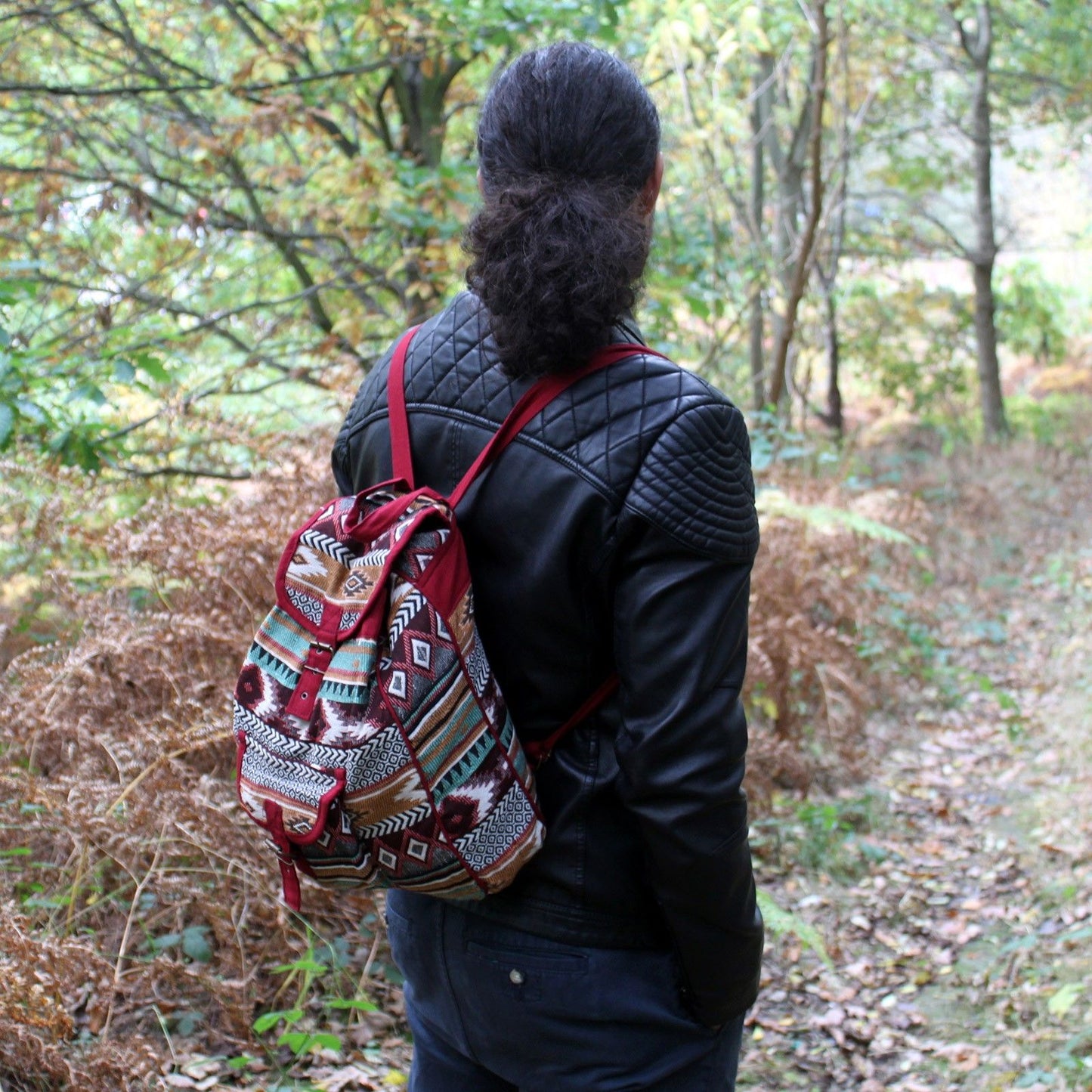 Bohemian style chocolate brown jacquard fabric backpack with ethnic patterns and adjustable straps.