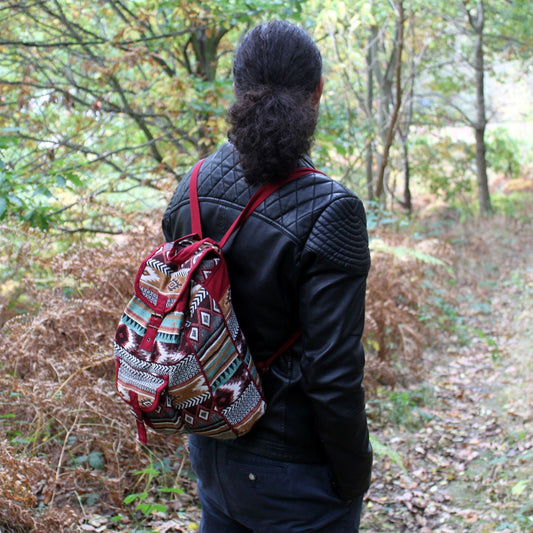 Bohemian style chocolate brown jacquard fabric backpack with ethnic patterns and adjustable straps.