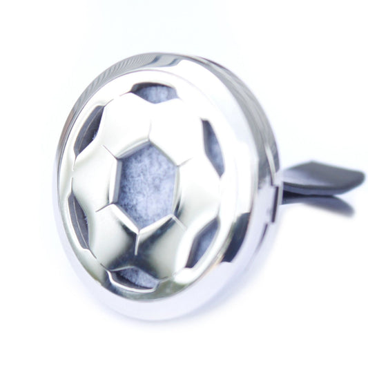 Round silver car vent clip aromatherapy locket with a decorative football cutout design and internal felt pad.