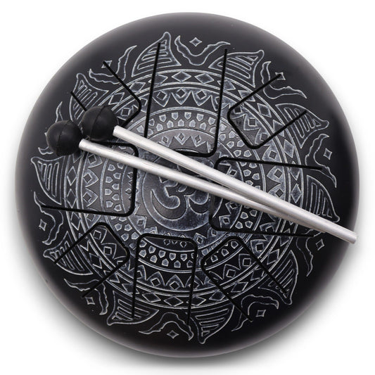 Circular steel hapi drum with an intricate Om Mandala design engraved on the surface in a metallic finish.