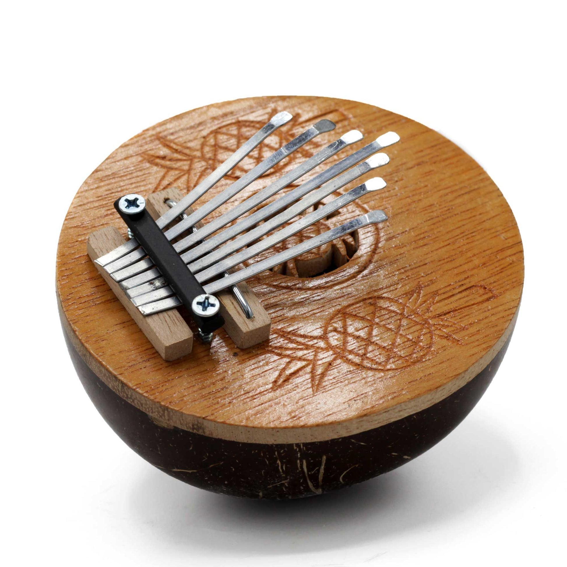 Handcrafted mini kalimba thumb piano made from a polished natural coconut shell with metal tines.