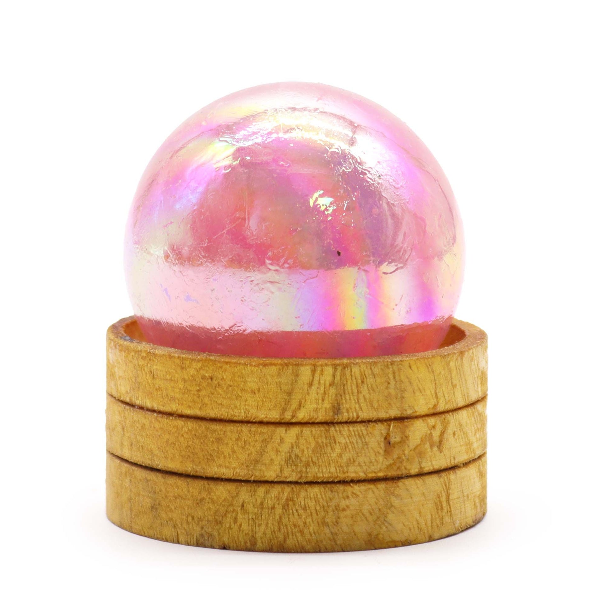 Iridescent pink 50mm gemstone sphere with a shimmering titanium aura finish resting on a small display stand.