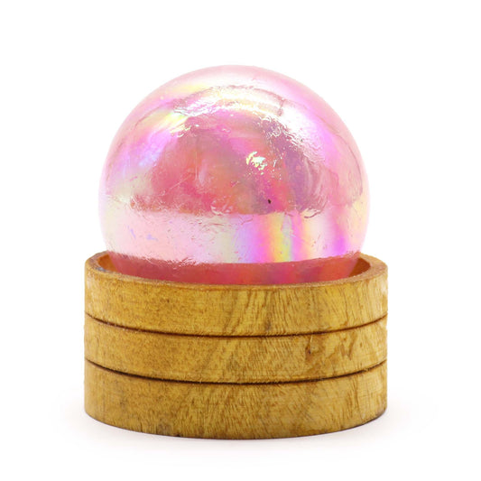 Iridescent pink 50mm gemstone sphere with a shimmering titanium aura finish resting on a small display stand.