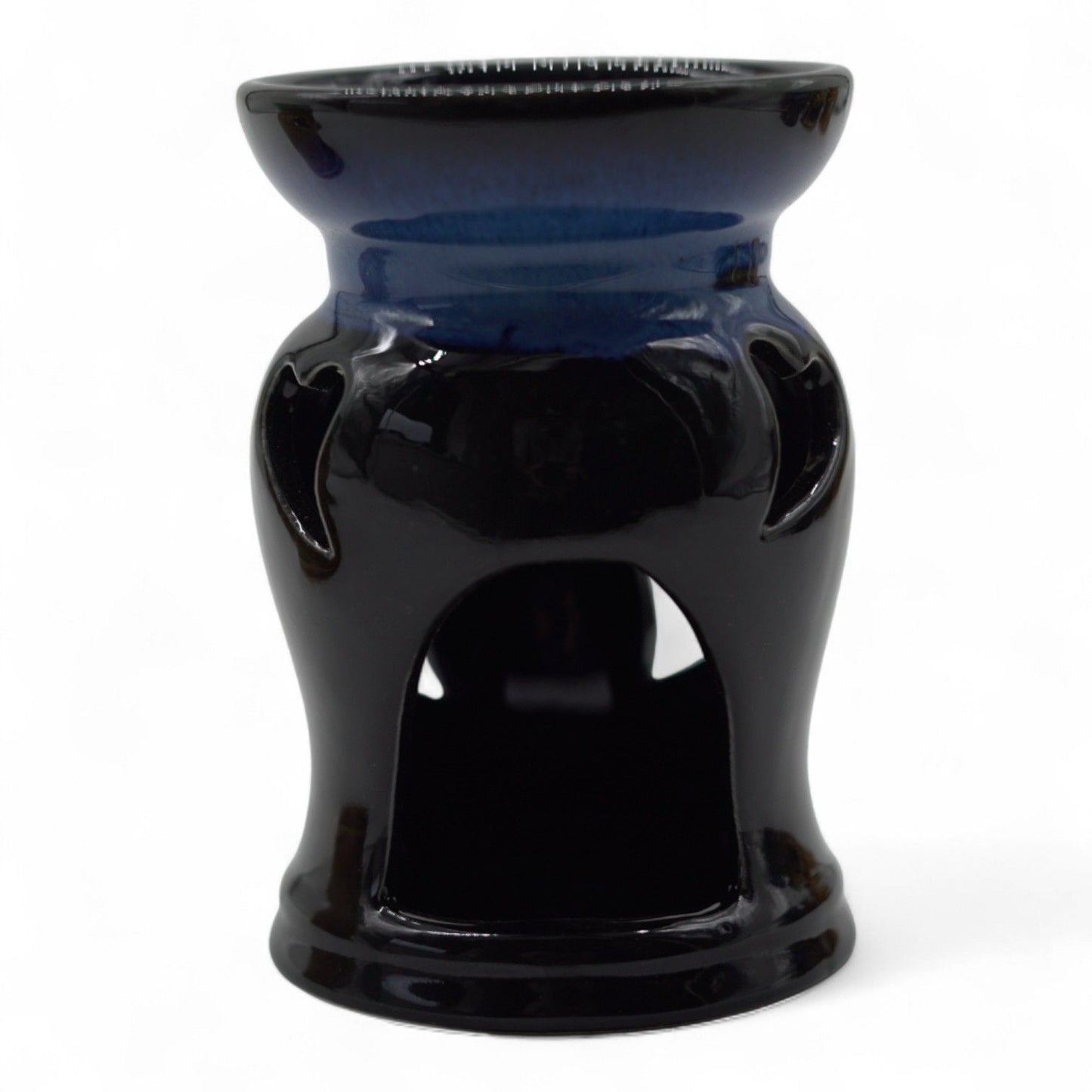 Rustic terracotta-style ceramic oil burner featuring a decorative heart cut-out design on a tactile surface.