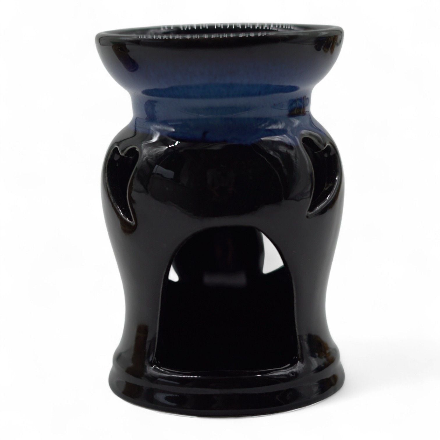 Rustic terracotta-style ceramic oil burner featuring a decorative heart cut-out design on a tactile surface.