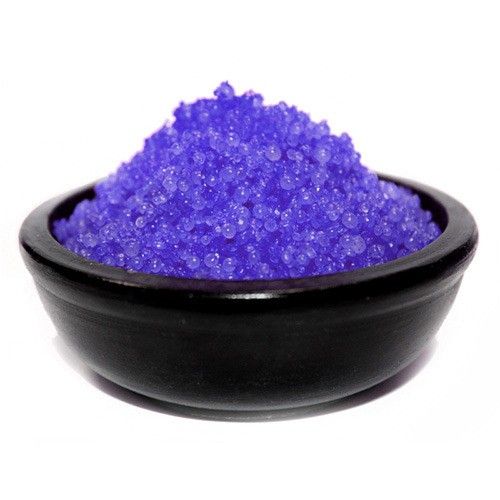 Pile of deep purple blackberry scented simmering granules for use in a home fragrance oil burner.