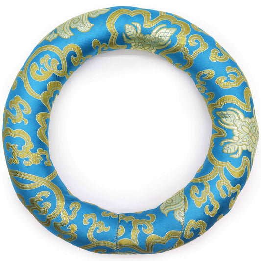 Handmade fabric hoop cushion for supporting a Tibetan singing bowl, shown in a vibrant assorted colour with detailed stitchin
