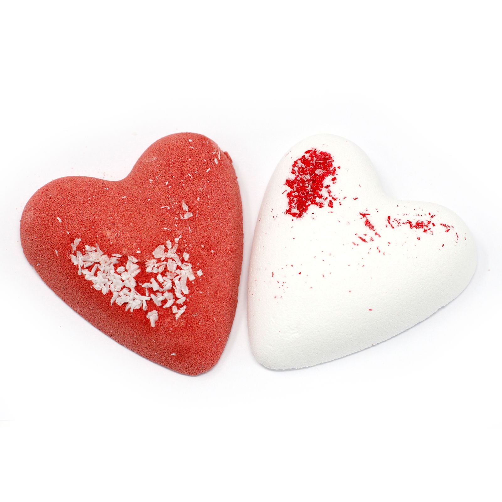 Large heart-shaped bath fizz with a textured surface and subtle botanical inclusions for a relaxing bath experience.