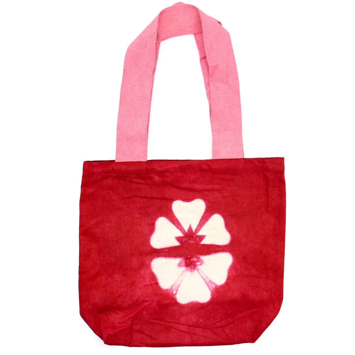 Handmade natural cotton tote bag with a maroon tie-dye flower design and a contrasting pink handle.