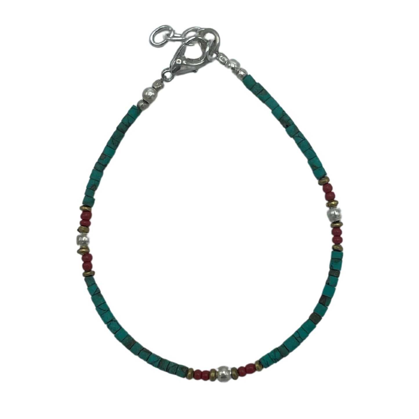 Handcrafted Nepalese bracelet featuring vibrant turquoise beads and earthy stone accents on a delicate cord.