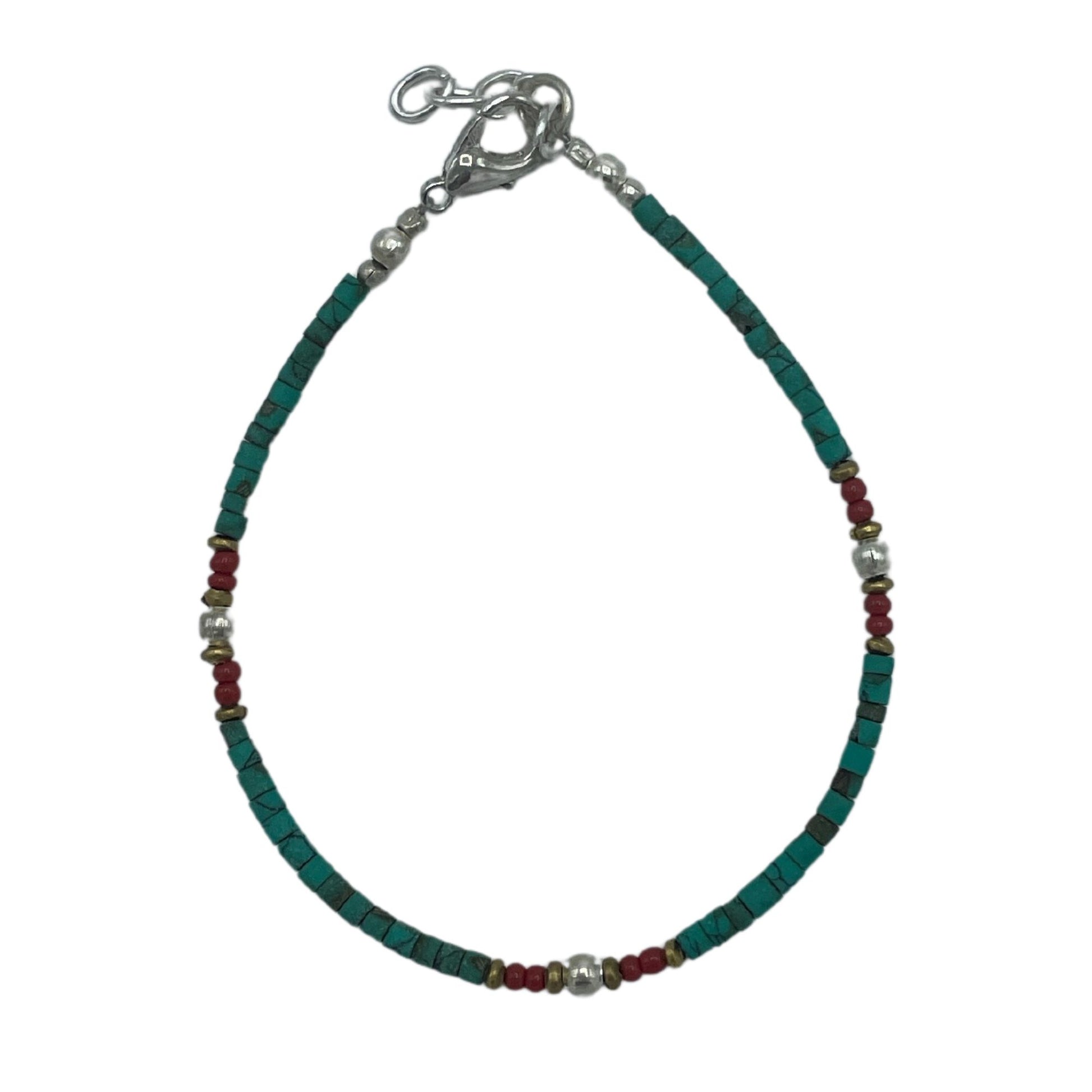 Handcrafted Nepalese bracelet featuring vibrant turquoise beads and earthy stone accents on a delicate cord.