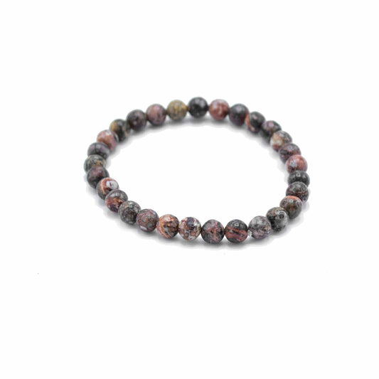 Gemstone manifestation bracelet featuring earthy spotted leopard skin jasper beads on an elasticated cord.