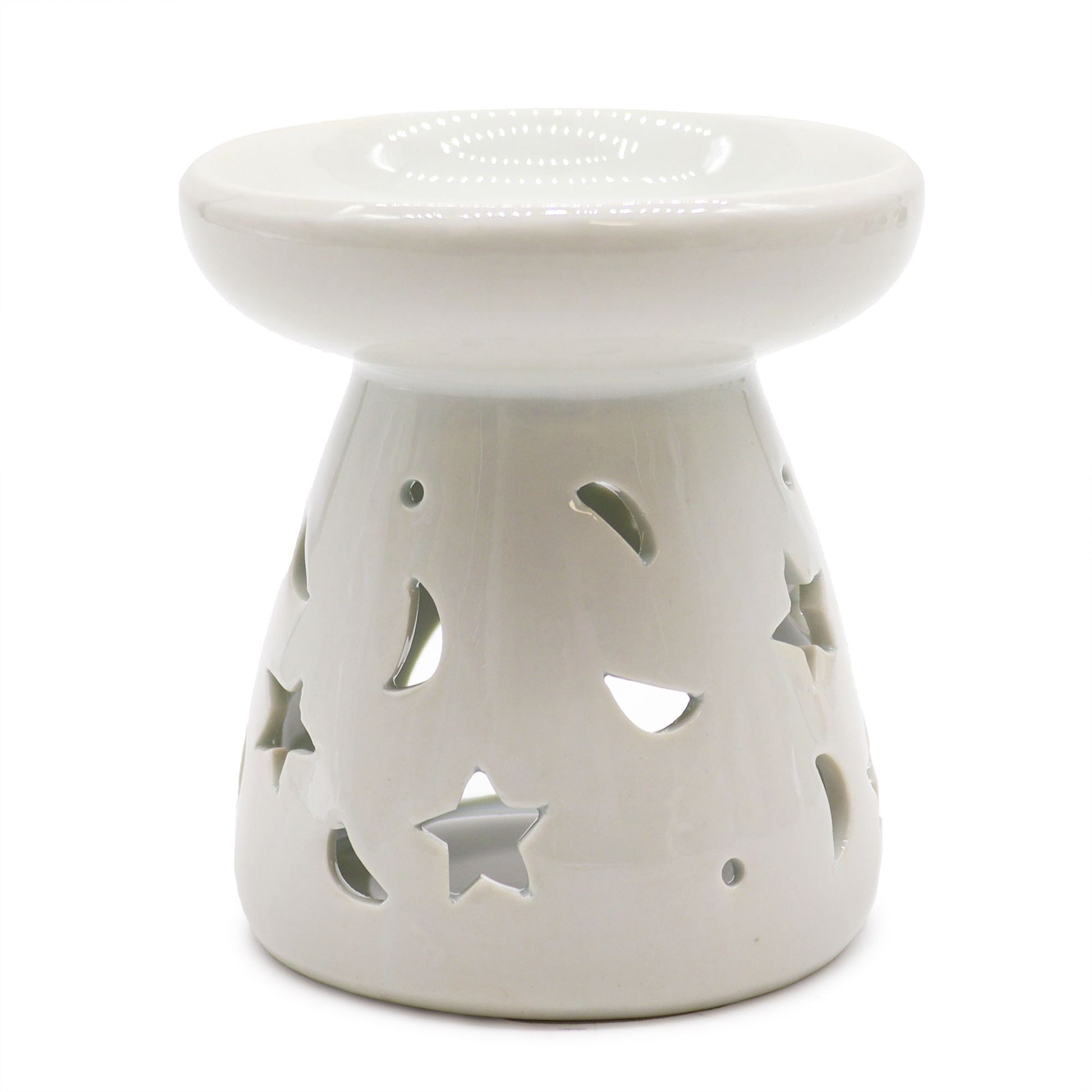 Large classic white ceramic oil burner with decorative moon and star cut-outs and a smooth finish.
