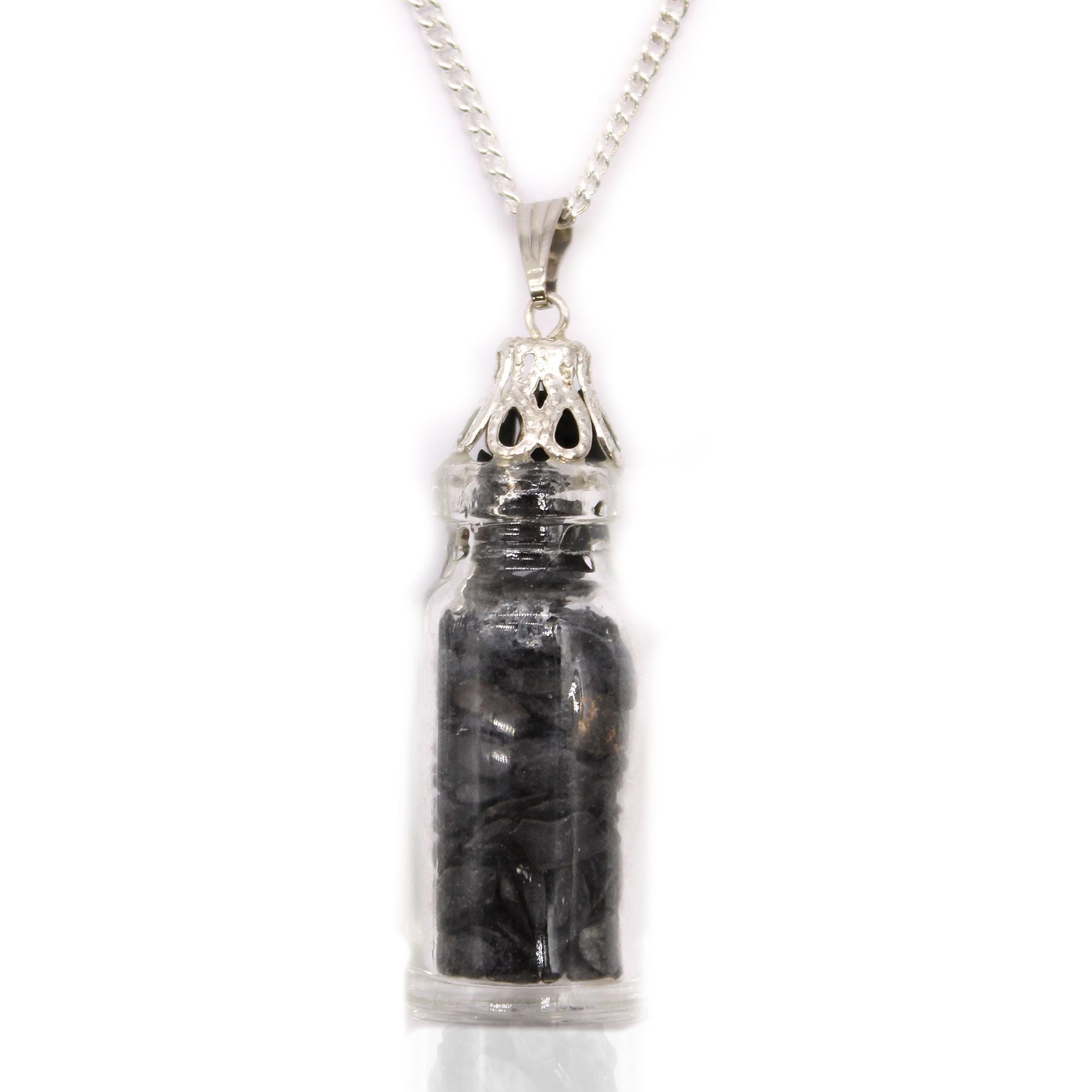 Delicate glass bottle pendant filled with small black onyx gemstones on a silver-coloured chain.