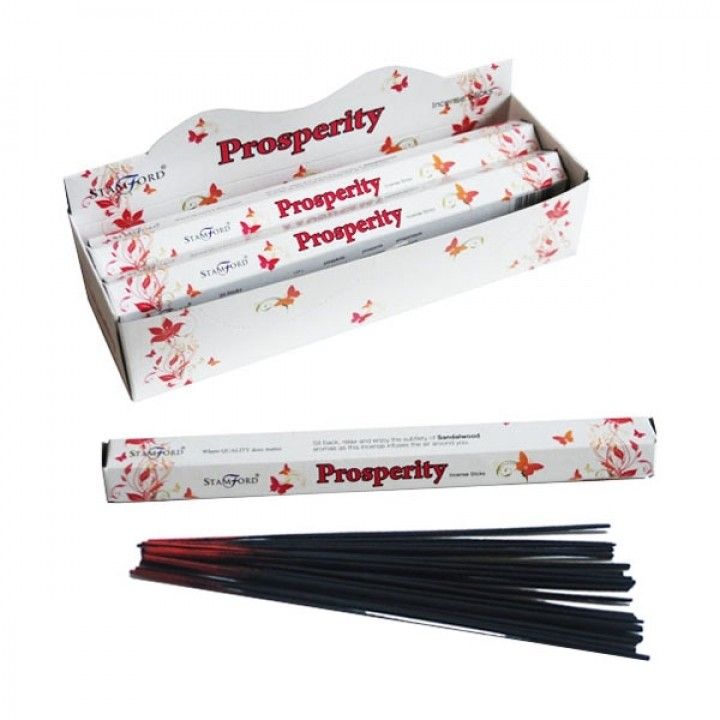 Hand-rolled incense sticks in a hexagonal box featuring a prosperity-themed design.