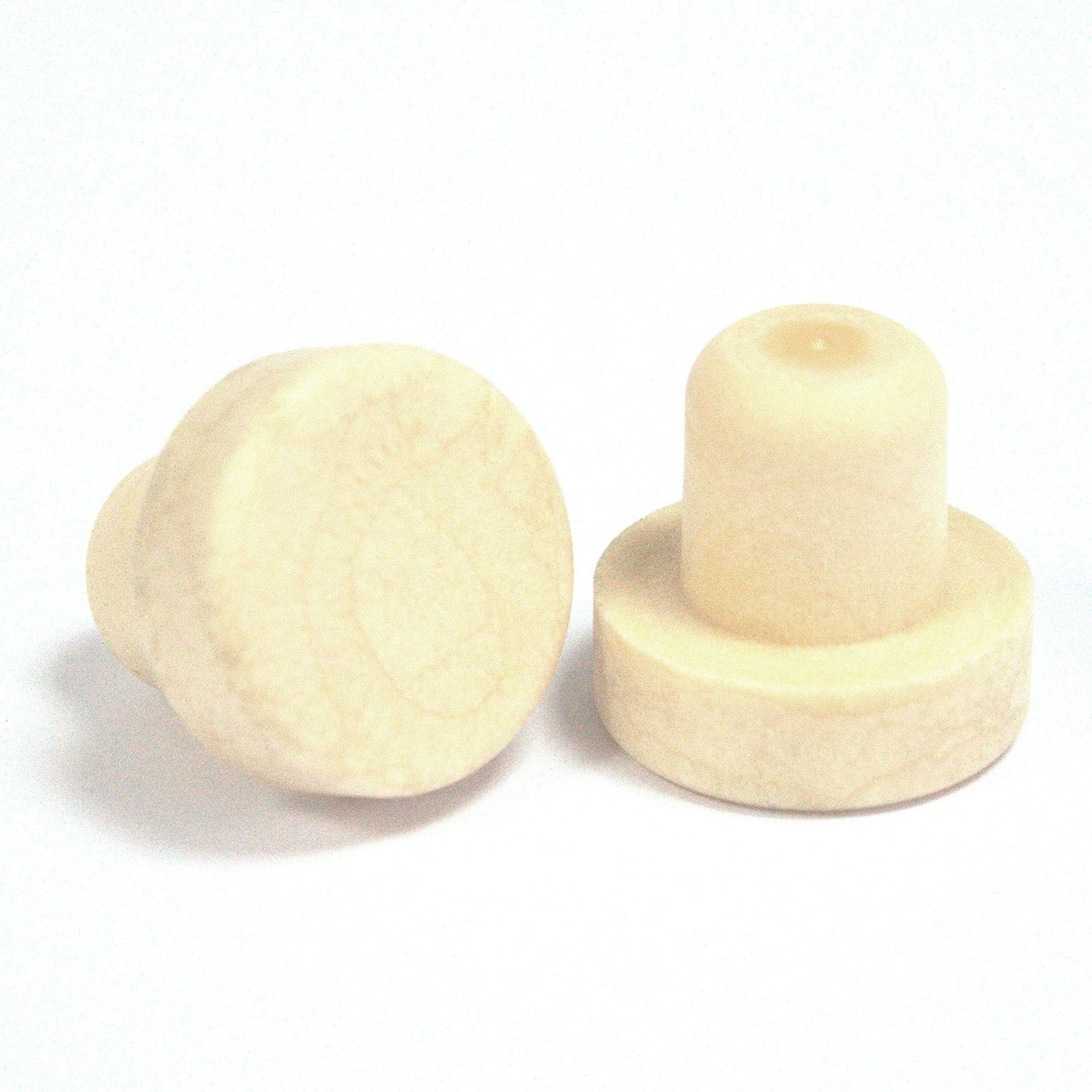Round wooden-style replacement cap for a glass reed diffuser bottle in a minimalist setting.