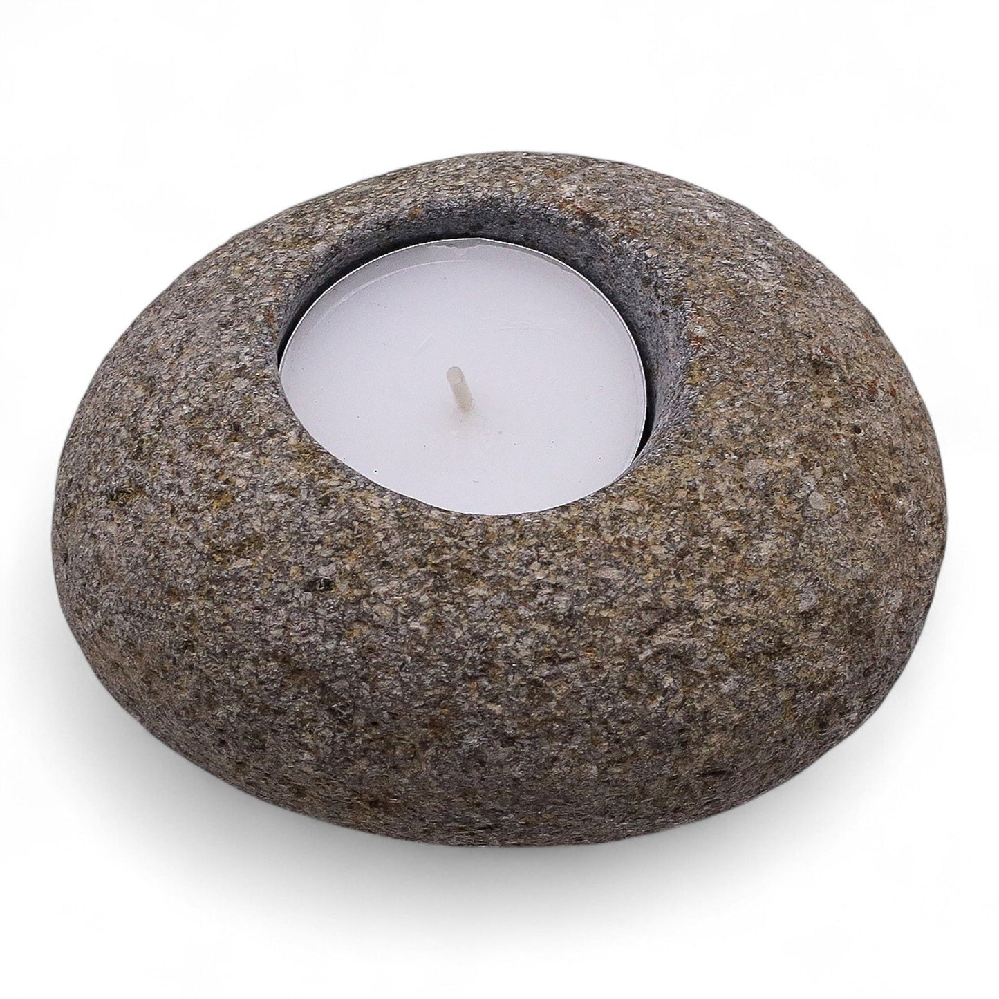 Hand-carved natural grey riverstone tea light candle holder with a raw organic texture and smooth central well.