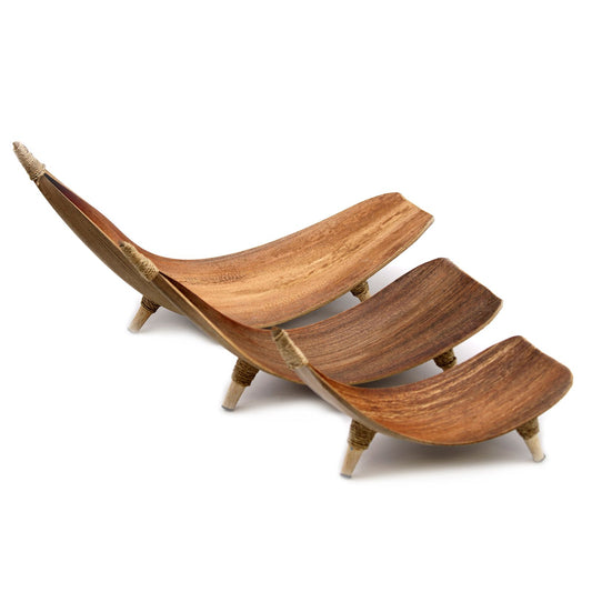 Handcrafted natural coconut leaf fruit bowl set with a unique curved shape and textured wood finish.
