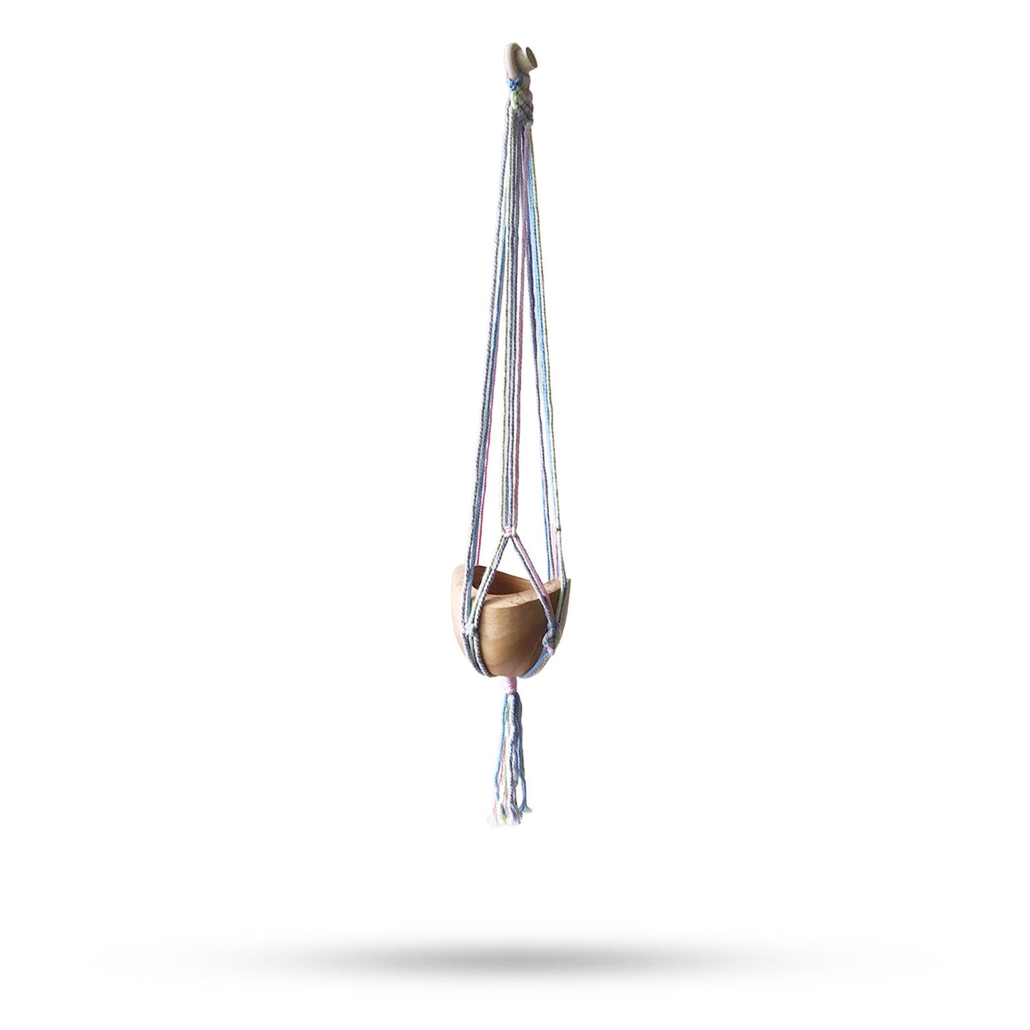 Handcrafted macrame pot holder in soft pastel tones featuring a classic knotted design for hanging plants or pots.