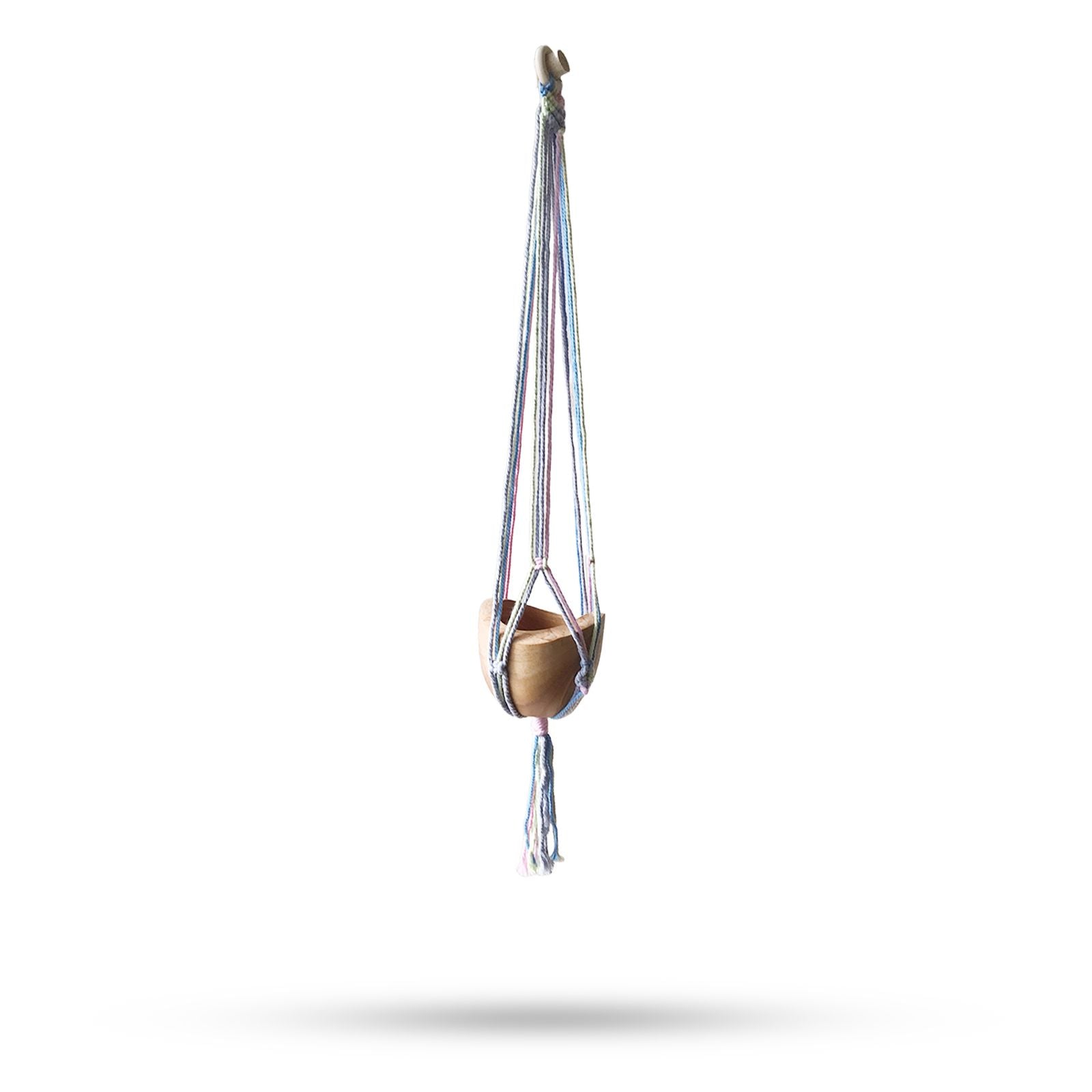 Handcrafted macrame pot holder in soft pastel tones featuring a classic knotted design for hanging plants or pots.
