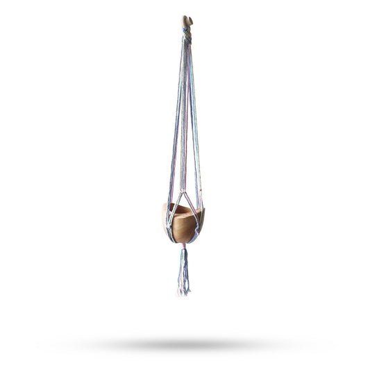 Handcrafted macrame pot holder in soft pastel tones featuring a classic knotted design for hanging plants or pots.