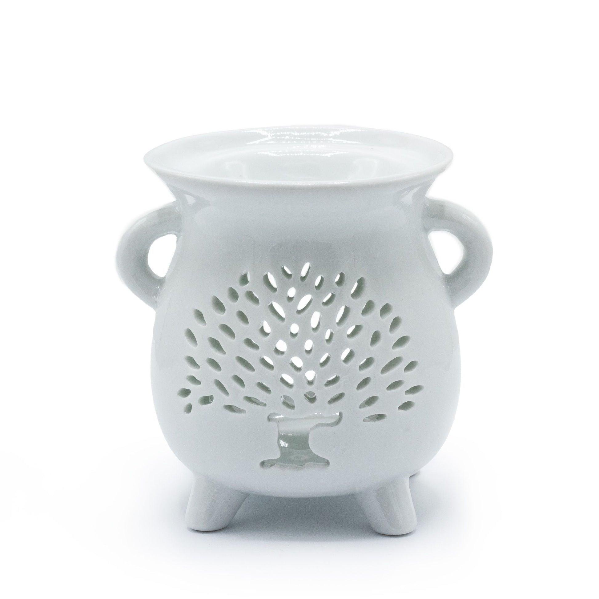 Elegant white ceramic oil burner featuring a decorative cut-out Tree of Life design on a smooth cylindrical base.