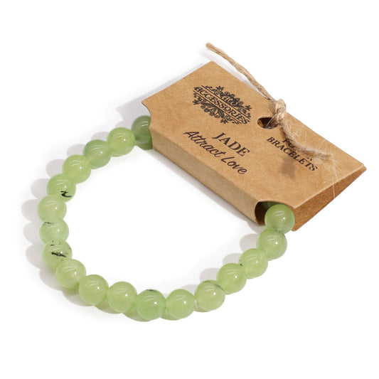 Stretch power bracelet featuring smooth, polished green jade gemstone beads.