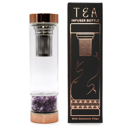 Elegant crystal glass tea infuser bottle with rose gold caps and violet amethyst gemstones at the base.