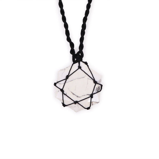 Hexagonal white howlite gemstone pendant with grey veining, featuring an intricate silver-style laced metal wrap.