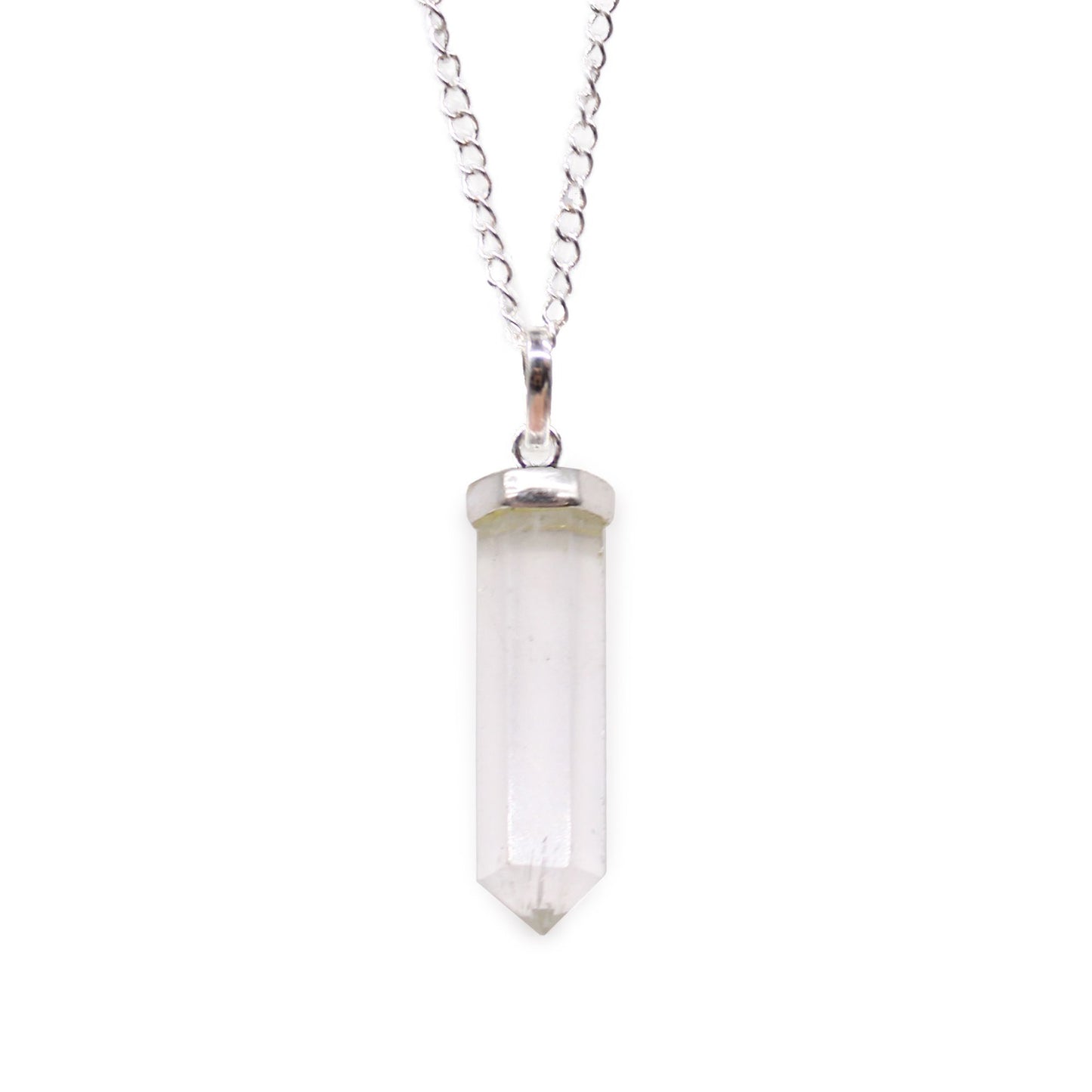 Clear rock quartz gemstone carved into a classic hexagonal point pendant with a silver-toned metal bale.
