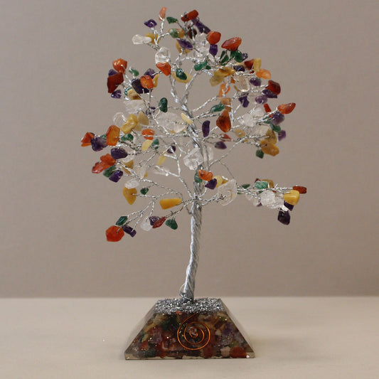 Handcrafted gemstone tree with multi-coloured stones on twisted wire branches and a decorative orgonite base.