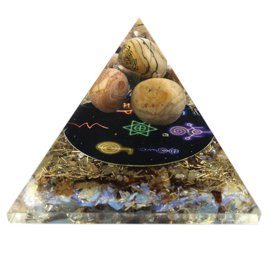 Sleek 70mm orgonite pyramid featuring dark resin, copper coils, and shimmering gemstone chips for energy healing.